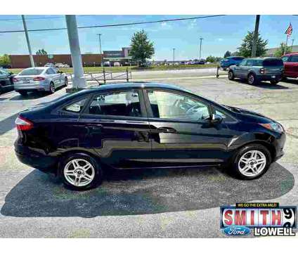 2019 Ford Fiesta SE is a Black 2019 Ford Fiesta SE Sedan in Lowell IN