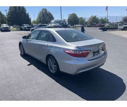 2015 Toyota Camry Hybrid SE is a Silver 2015 Toyota Camry Hybrid SE Hybrid in Logan UT