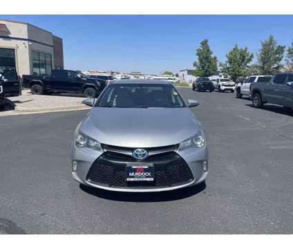 2015 Toyota Camry Hybrid SE is a Silver 2015 Toyota Camry Hybrid SE Hybrid in Logan UT