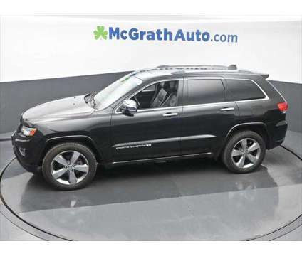 2014 Jeep Grand Cherokee Overland is a Black 2014 Jeep grand cherokee Overland SUV in Dubuque IA