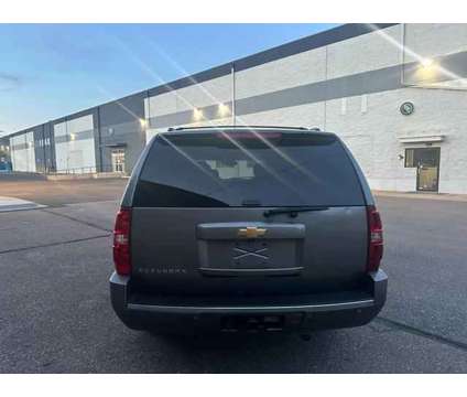 2013 Chevrolet Suburban 1500 for sale is a Gold 2013 Chevrolet Suburban 1500 Trim Car for Sale in Englewood CO