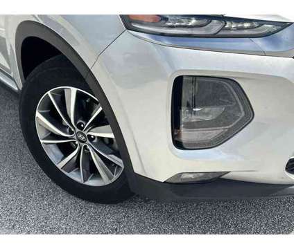 2019 Hyundai Santa Fe SEL Plus is a Silver 2019 Hyundai Santa Fe SE SUV in Stuart FL