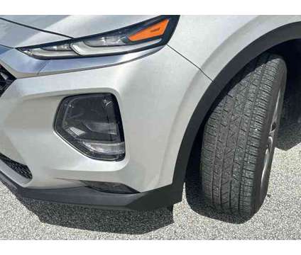 2019 Hyundai Santa Fe SEL Plus is a Silver 2019 Hyundai Santa Fe SE SUV in Stuart FL