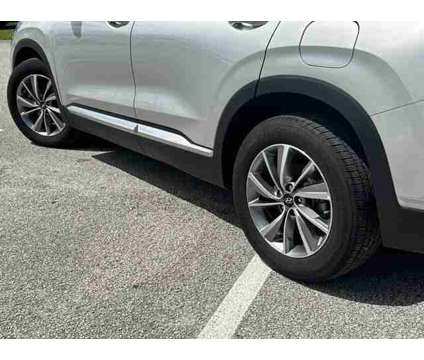 2019 Hyundai Santa Fe SEL Plus is a Silver 2019 Hyundai Santa Fe SE SUV in Stuart FL