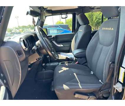 2015 Jeep Wrangler Unlimited Sahara is a Black 2015 Jeep Wrangler Unlimited Sahara SUV in Wichita KS