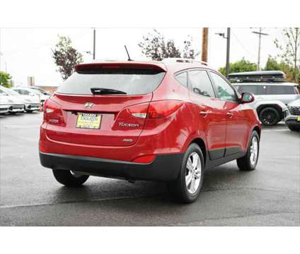 2013 Hyundai Tucson GLS is a Red 2013 Hyundai Tucson GLS SUV in Edmonds WA