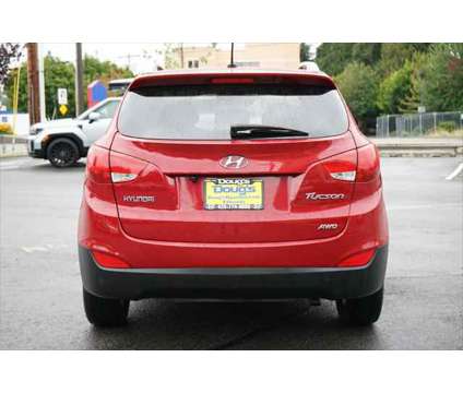 2013 Hyundai Tucson GLS is a Red 2013 Hyundai Tucson GLS SUV in Edmonds WA