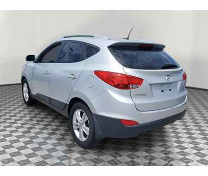 2010 Hyundai Tucson GLS is a Silver 2010 Hyundai Tucson GLS SUV in Orlando FL