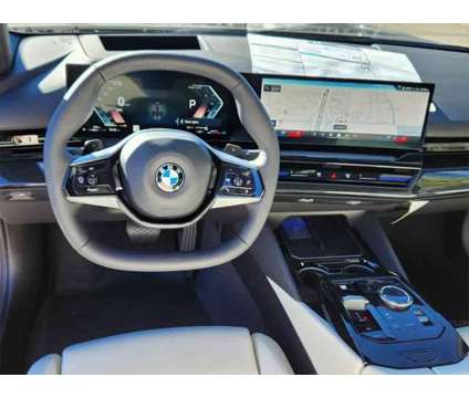 2024 BMW 5 Series i xDrive is a Grey 2024 BMW 5-Series Sedan in Loveland CO