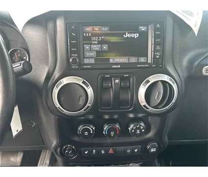 2015 Jeep Wrangler Sahara is a White 2015 Jeep Wrangler Sahara SUV in Fort Pierce FL