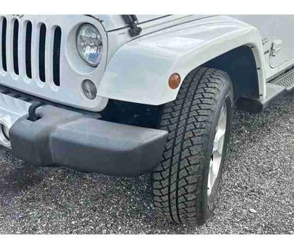 2015 Jeep Wrangler Sahara is a White 2015 Jeep Wrangler Sahara SUV in Fort Pierce FL