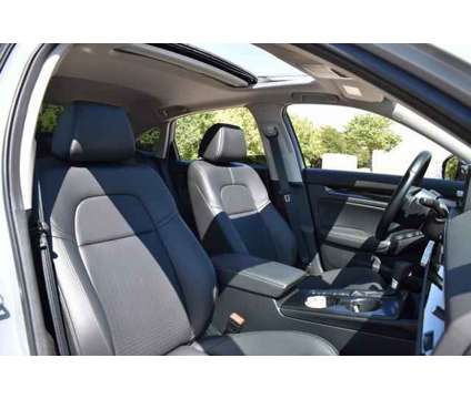 2024 Honda Civic Touring Sedan is a Blue 2024 Honda Civic Touring Sedan in Lawrence KS