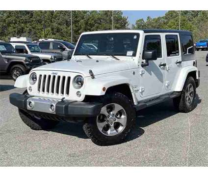 2016 Jeep Wrangler Unlimited Sahara is a White 2016 Jeep Wrangler Unlimited Sahara SUV in Canton GA