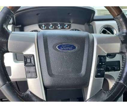 2014 Ford F-150 Platinum is a Red 2014 Ford F-150 Platinum Truck in Woods Cross UT