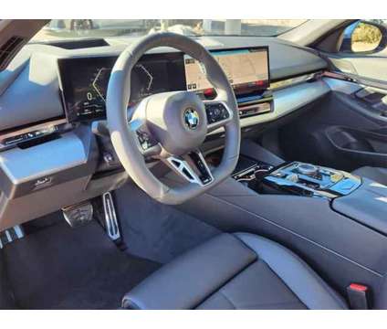 2024 BMW 5 Series i xDrive is a Blue 2024 BMW 5-Series Sedan in Loveland CO