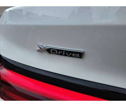 2024 BMW 2 Series i xDrive is a White 2024 Sedan in Loveland CO