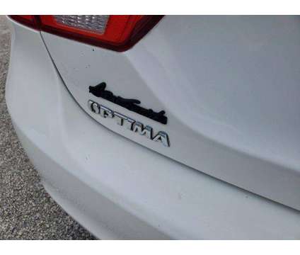 2009 Kia Optima LX is a White 2009 Kia Optima LX Sedan in Orlando FL