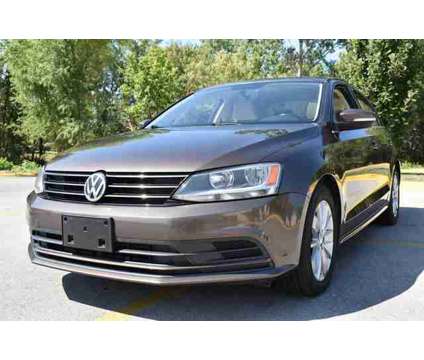 2015 Volkswagen Jetta 2.0L TDI SE is a Brown 2015 Volkswagen Jetta 2.5 Trim Sedan in Lawrence KS