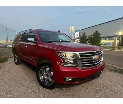 2015 Chevrolet Suburban for sale is a Red 2015 Chevrolet Suburban 1500 Trim Car for Sale in Englewood CO