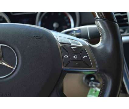 2013 Mercedes-Benz M-Class 4MATIC is a Black 2013 Mercedes-Benz M Class SUV in Houston TX