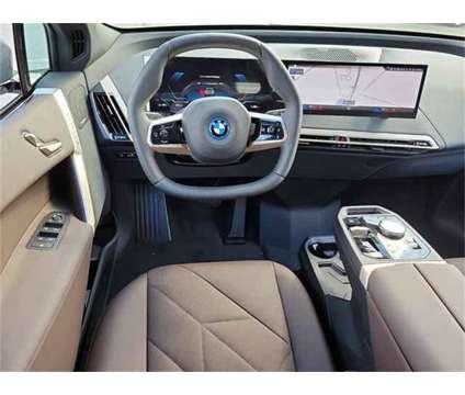 2024 BMW iX xDrive50 is a Grey 2024 BMW 325 Model iX SUV in Milford DE