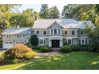 In the coveted neighborhood of Flower Hill Manhasset