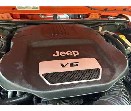 2015 Jeep Wrangler Unlimited Sport is a Orange 2015 Jeep Wrangler Unlimited Sport SUV in Fort Lauderdale FL