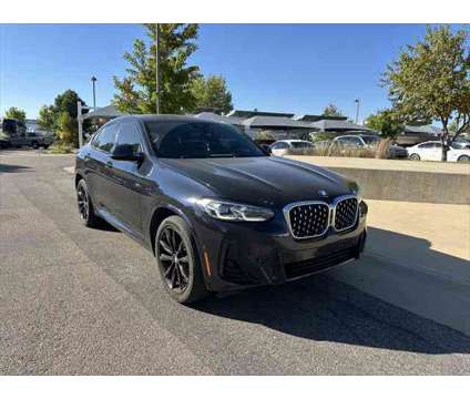 2022 BMW X4 xDrive30i is a Black 2022 BMW X4 xDrive30i SUV in Loveland CO