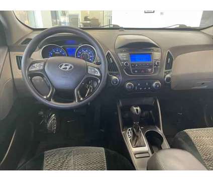 2015 Hyundai Tucson GLS is a Red 2015 Hyundai Tucson GLS SUV in Logan UT