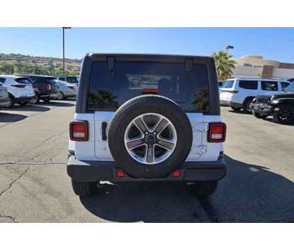 2020 Jeep Wrangler Unlimited Sahara 4X4 is a White 2020 Jeep Wrangler Unlimited Sahara SUV in Saint George UT