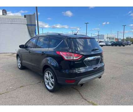 2014 Ford Escape Titanium is a Black 2014 Ford Escape Titanium SUV in Dubuque IA