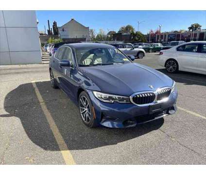 2022 BMW 3 Series xDrive is a Blue 2022 BMW 3-Series Sedan in Freeport NY