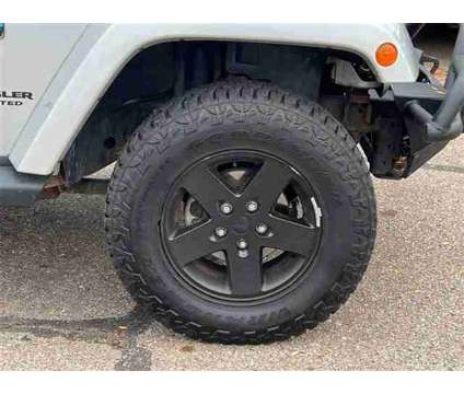 2012 Jeep Wrangler Unlimited Arctic is a Silver 2012 Jeep Wrangler Unlimited Car for Sale in Howell MI