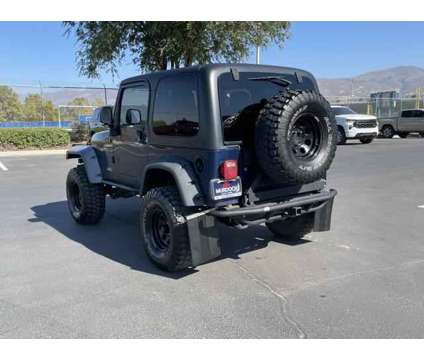 2004 Jeep Wrangler Sport is a Black, Blue 2004 Jeep Wrangler Sport SUV in Woods Cross UT