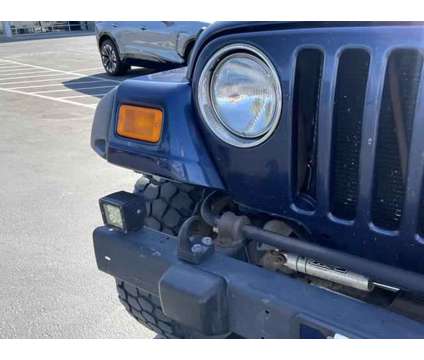 2004 Jeep Wrangler Sport is a Black, Blue 2004 Jeep Wrangler Sport SUV in Woods Cross UT