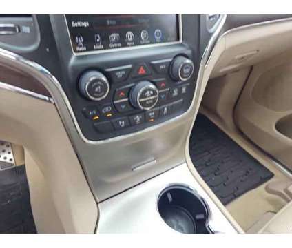 2014 Jeep Grand Cherokee Overland is a Black 2014 Jeep grand cherokee Overland Car for Sale in Atlanta GA