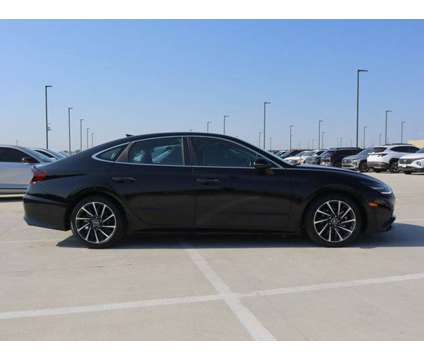 2023 Hyundai Sonata Limited is a Black 2023 Hyundai Sonata Limited Sedan in Friendswood TX