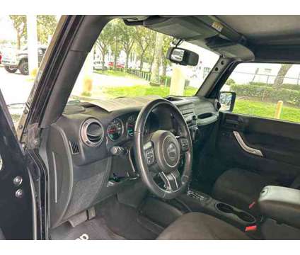 2015 Jeep Wrangler Unlimited Sport is a Black 2015 Jeep Wrangler Unlimited Sport SUV in Fort Lauderdale FL