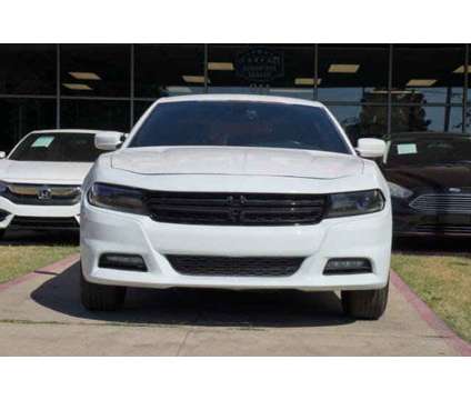 2016 Dodge Charger SXT is a White 2016 Dodge Charger SXT Sedan in Arlington TX