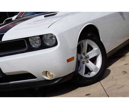 2013 Dodge Challenger SXT is a White 2013 Dodge Challenger SXT Coupe in Arlington TX