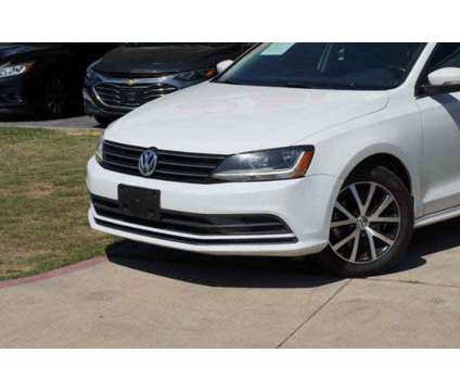 2017 Volkswagen Jetta 1.4T SE is a Silver, White 2017 Volkswagen Jetta 1.4T SE Sedan in Arlington TX