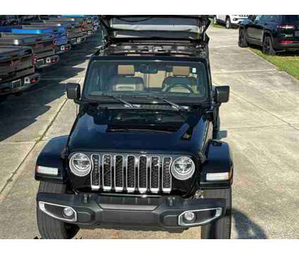 2021 Jeep Wrangler 4xe Unlimited Sahara is a Black 2021 Jeep Wrangler SUV in Vero Beach FL