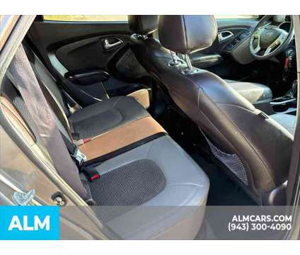 2013 Hyundai Tucson GLS is a Tan 2013 Hyundai Tucson GLS SUV in Lithia Springs GA