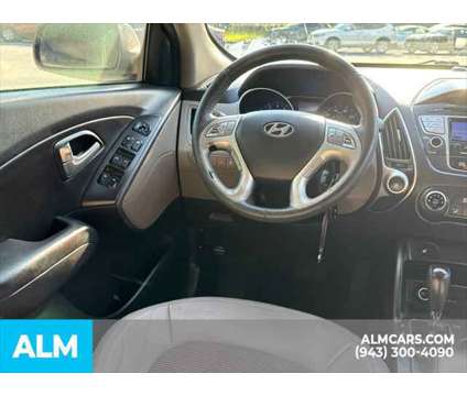 2013 Hyundai Tucson GLS is a Tan 2013 Hyundai Tucson GLS SUV in Lithia Springs GA