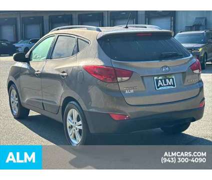 2013 Hyundai Tucson GLS is a Tan 2013 Hyundai Tucson GLS SUV in Lithia Springs GA