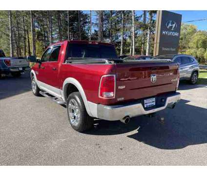 2014 Ram 1500 Laramie is a Red 2014 RAM 1500 Model Laramie Truck in Stevens Point WI