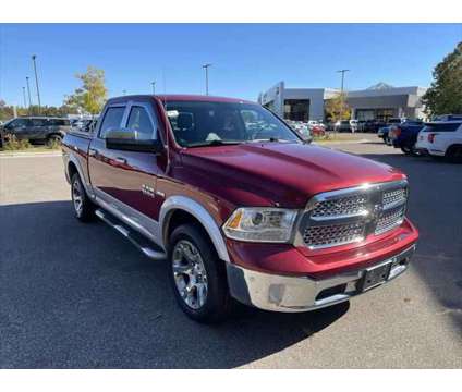 2014 Ram 1500 Laramie is a Red 2014 RAM 1500 Model Laramie Truck in Stevens Point WI