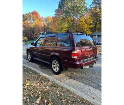 2003 Nissan Pathfinder LE 4WD is a Red 2003 Nissan Pathfinder LE SUV in Elizabeth NJ